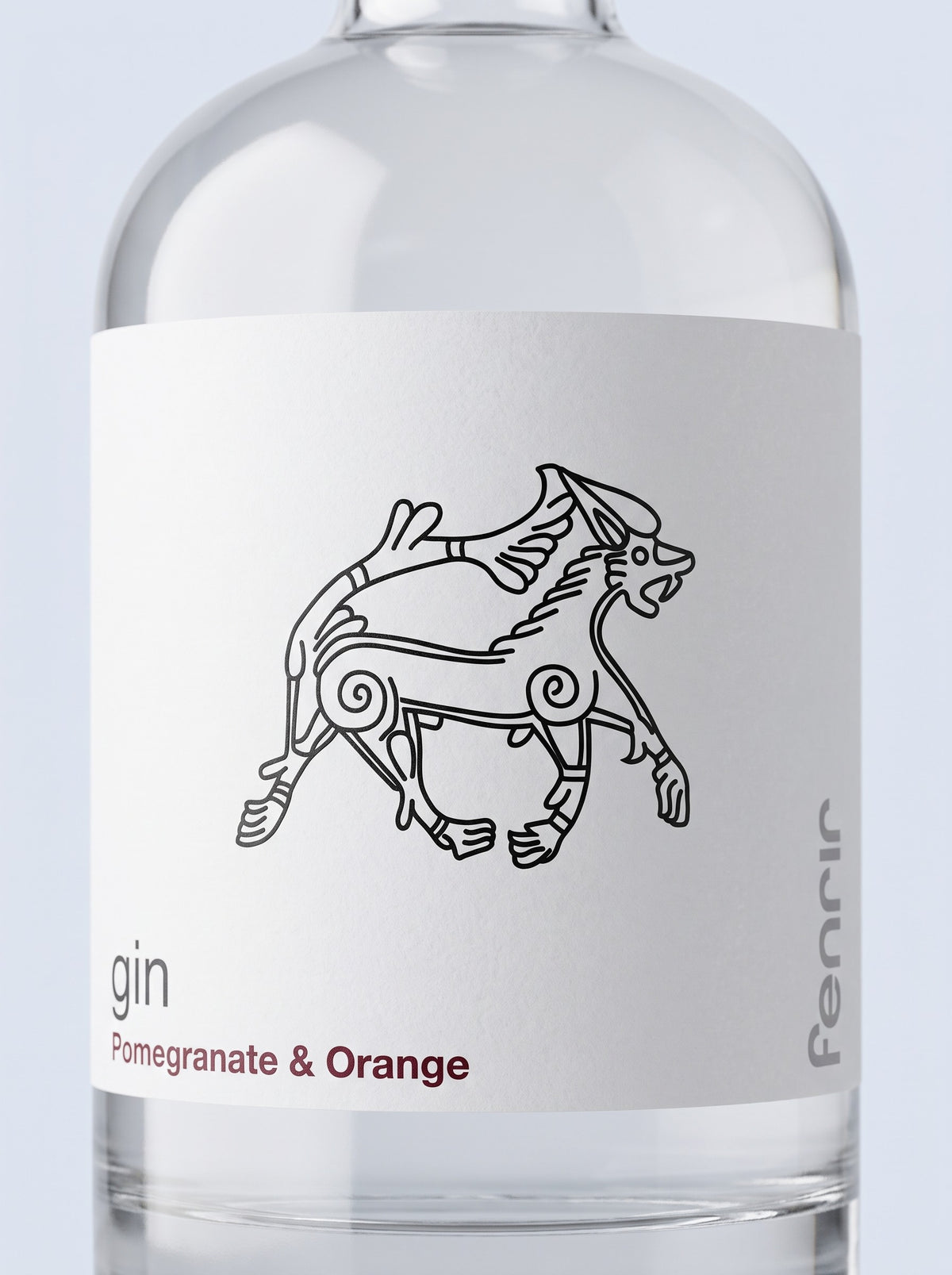 Close-up of the Fenrir label: the line-drawn wolf, gin, and Pomegranate & Orange in oxblood