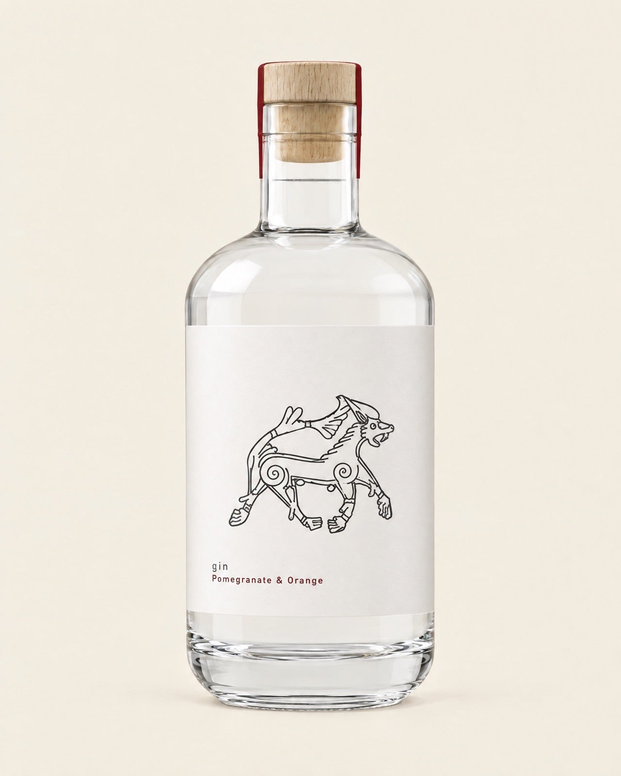 Fenrir Pomegranate & Orange gin, front of the bottle, with the flavour printed in oxblood red