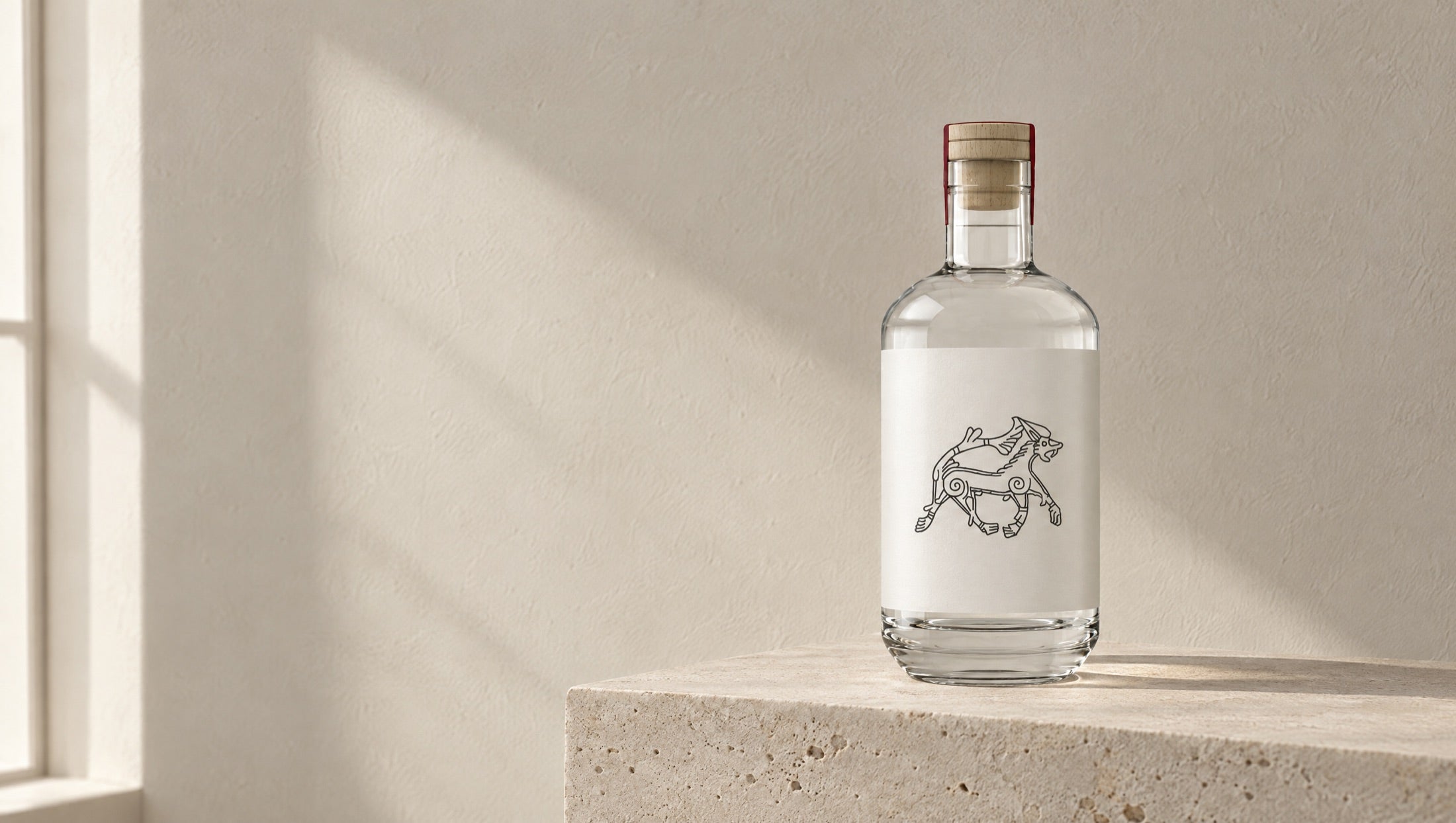 The bottle on a pale stone plinth in soft daylight