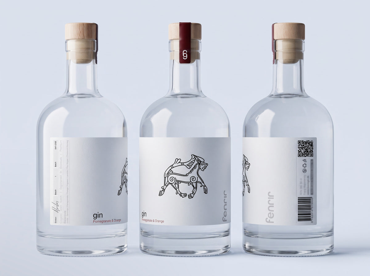 Three bottles of Fenrir gin showing the front, side and back of the label, on a pale mist background